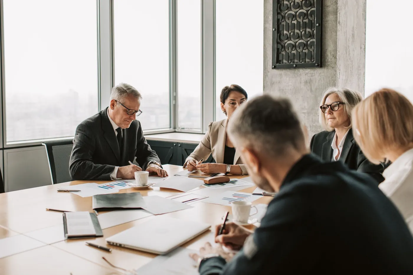 A Prime account lead briefing an employer's hiring managers in a Chicago office